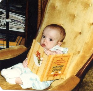 Me at four months old, desperately grasping my favorite book
